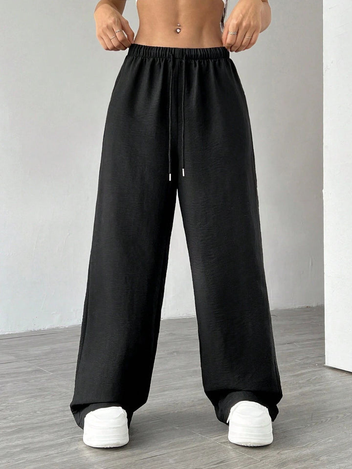 Damen Weite Lounge-Hose mit hohem Elastikbund und Kordelzug Echoarchiv