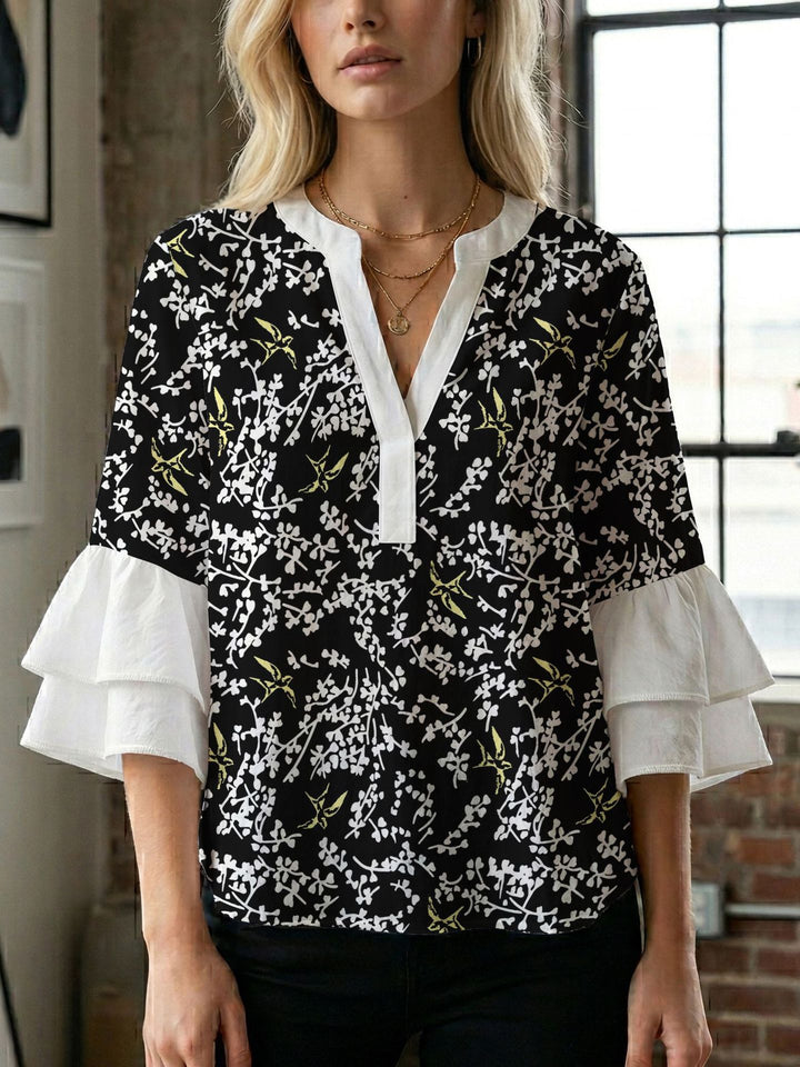 Damen Blusenshirt mit voluminösen Ärmeln und kreativem Druckdesign Echo Archiv