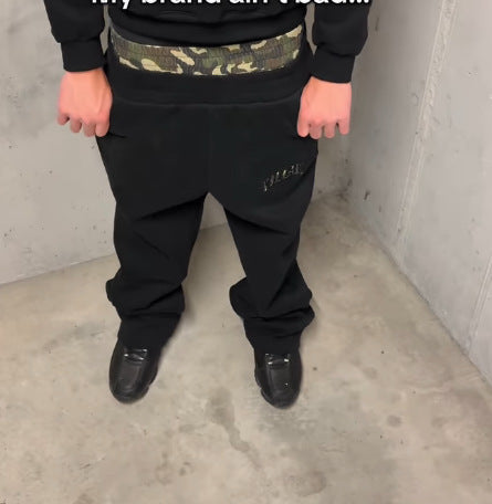 Damen nan hochgeschnittene Jogginghose mit ausgestelltem Bein, elastischem Rüschbund und Leo-Stickdetail Echo Archiv