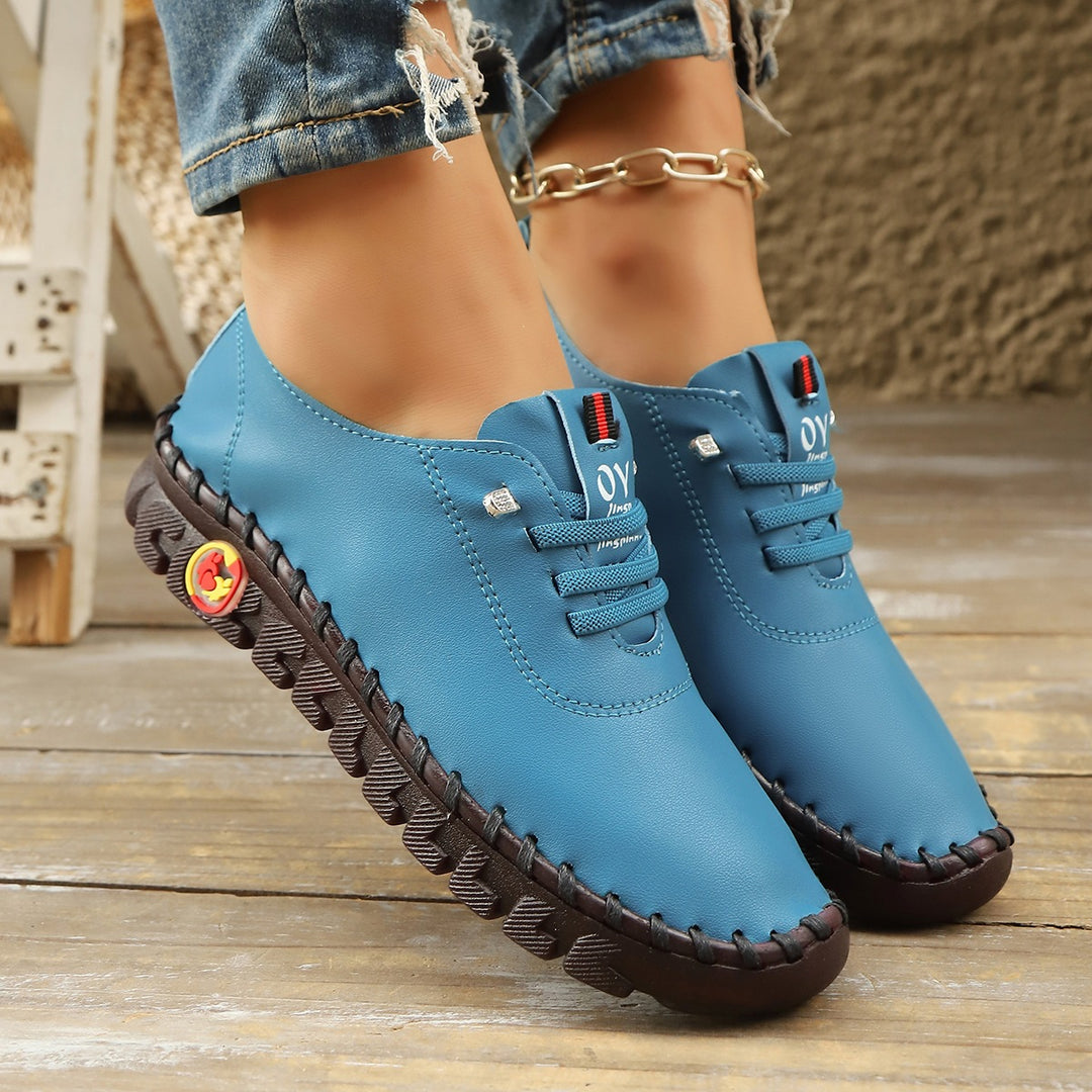 Damen Bequeme Lederoptik-Slipper mit flexibler Profilsohle und Mokassin-Naht – Lioré