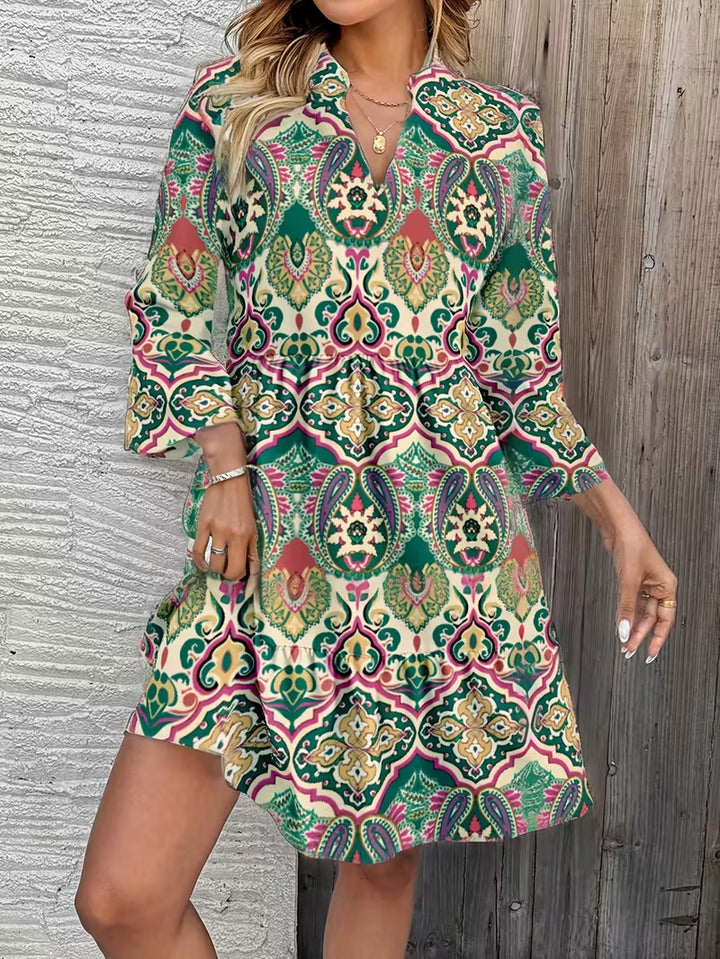 Damen Florales Babydoll-Kleid mit V-Ausschnitt, hohem Empire‑Bund und Glockenärmeln Echo Archiv