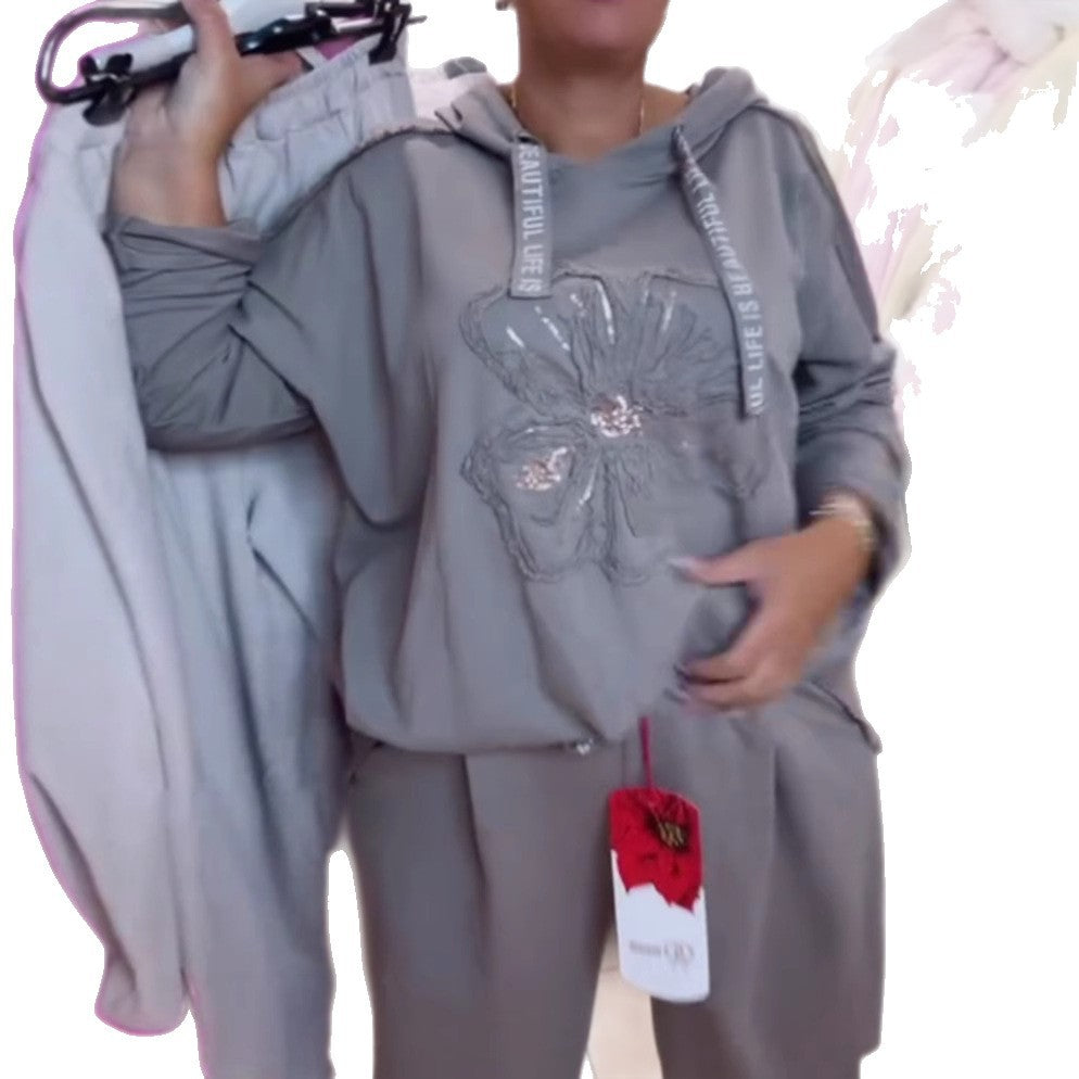 Damen nan entspanntes Lounge-Set mit Blüten-Pailletten-Hoodie, Kordelzug und weiter Bundfaltenhose Echo Archiv