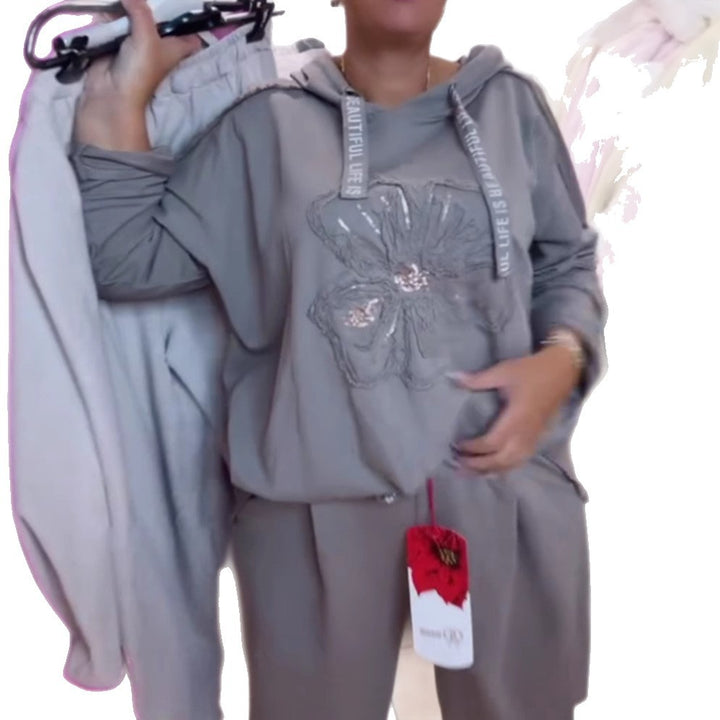 Damen nan entspanntes Lounge-Set mit Blüten-Pailletten-Hoodie, Kordelzug und weiter Bundfaltenhose Echo Archiv