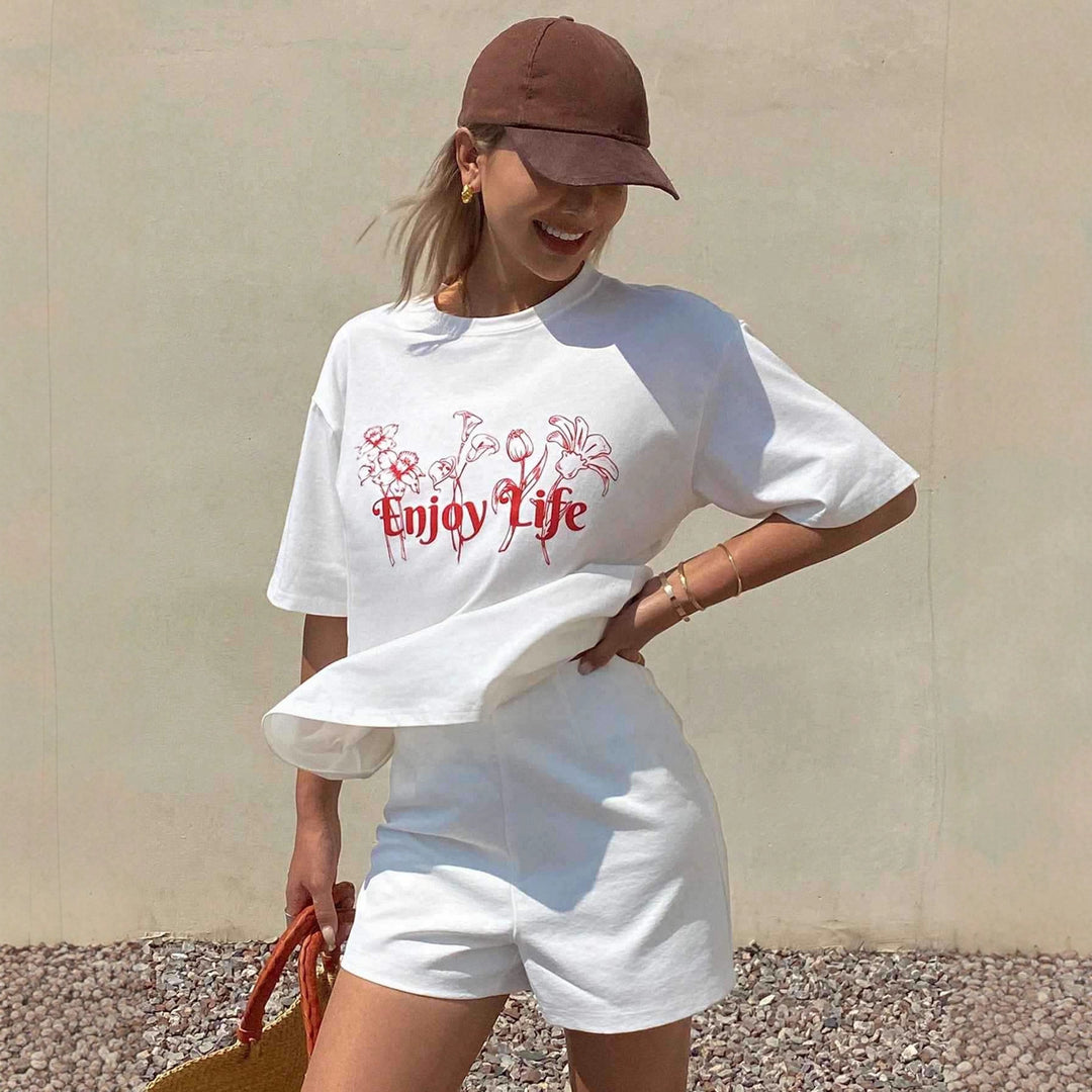Damen Lässiges Oversize-T-Shirt mit floralem Druck und inspirierendem Schriftzug Echo Archiv