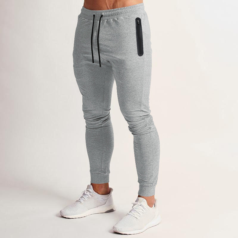 Herren schmal geschnittene Jogginghose mit Reißverschlusstaschen und Kordelzug Echoarchiv