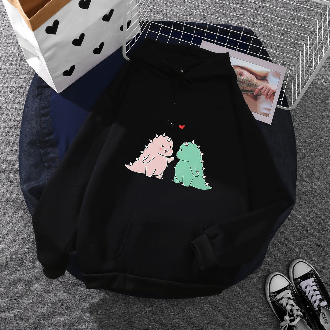 Damen Kapuzenpullover mit niedlicher Dinosaurierpärchen‑Illustration, Oversize‑Schnitt und Kängurutasche – Auréline