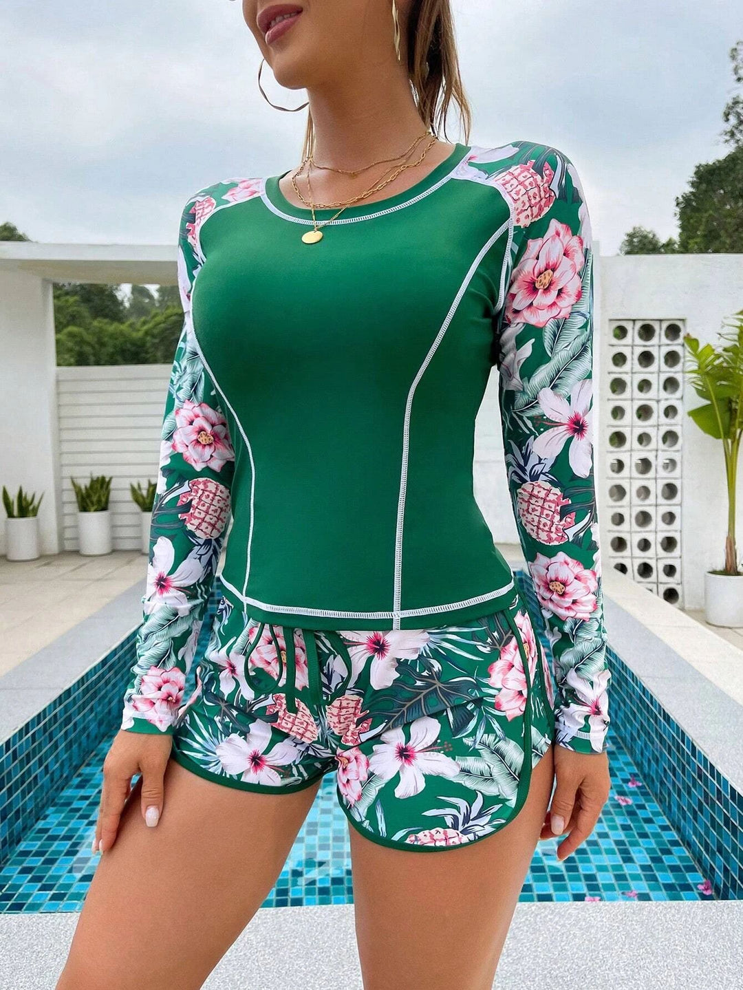 Damen Langarm Surf-Badeanzug mit floralem Muster Echo Archiv