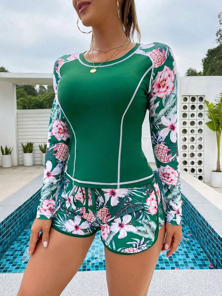 Damen Langarm Surf-Badeanzug mit floralem Muster Echo Archiv