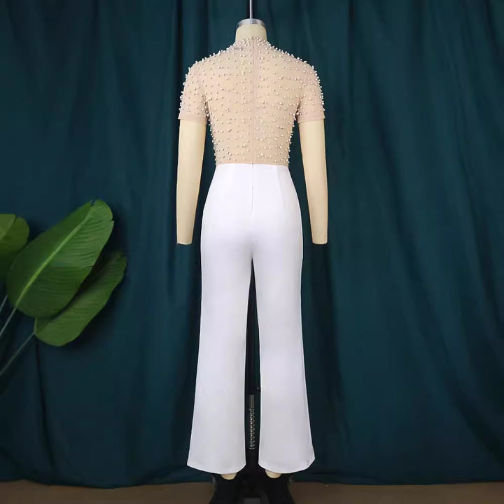 Damen eleganter Jumpsuit mit glitzernden Perlenakzenten Echo Archiv