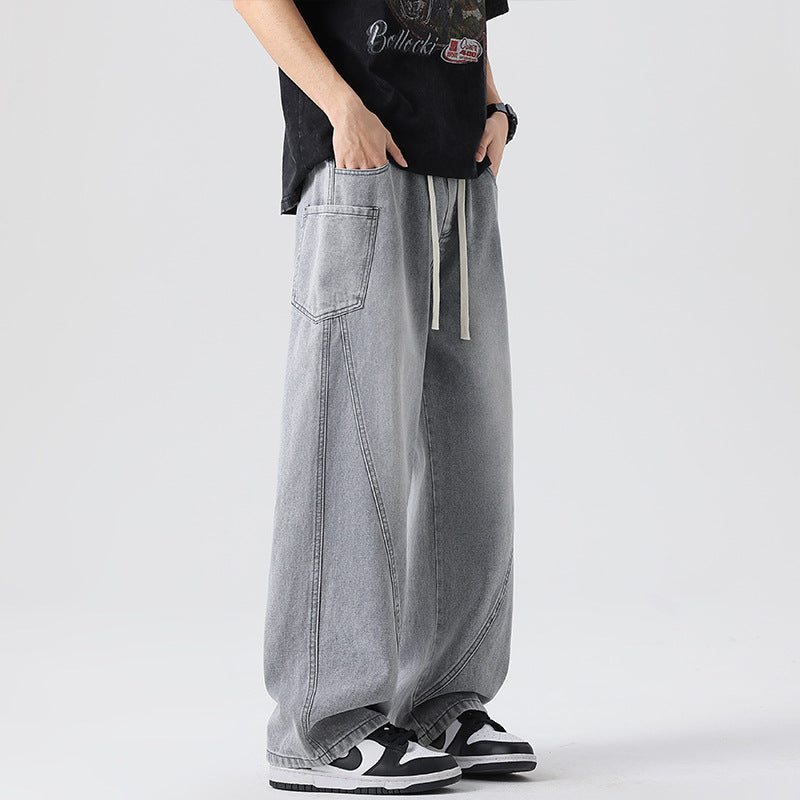 Herren Extraweite Denim-Baggyhose mit Tunnelzugbund und Paneelnähten Echo Archiv
