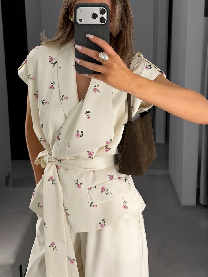 Damen Ärmellose Wickelbluse mit tailliertem Bindegürtel und Pattentaschen Echoarchiv