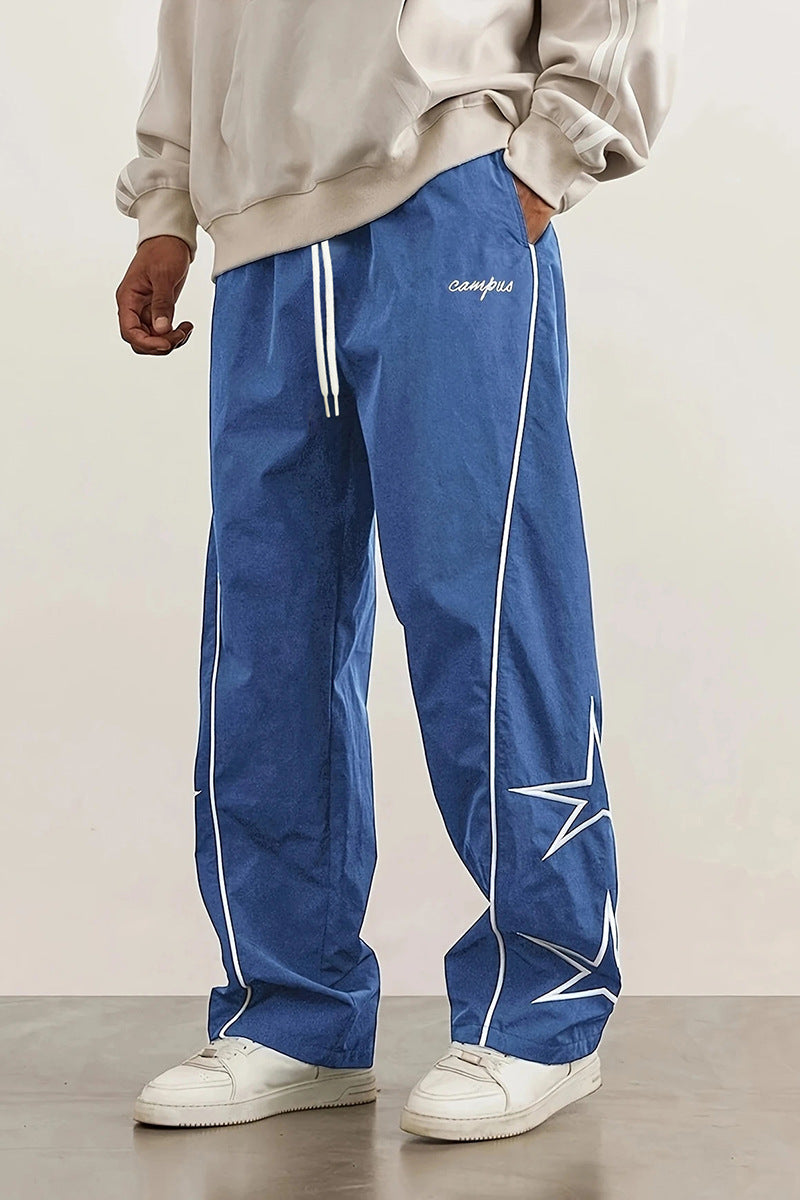 Herren Weite Trackpants mit Kontrastpaspel, Kordelzug und Sternapplikation Echo Archiv
