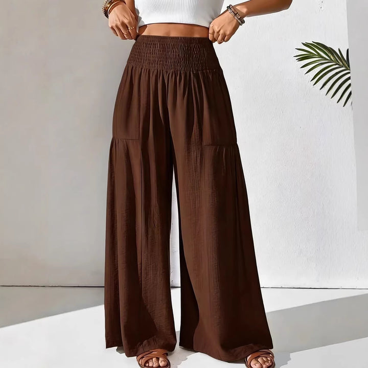 Damen weite Palazzo-Hose mit gerafftem Smock-Bund und Stufendetails – Avélisse