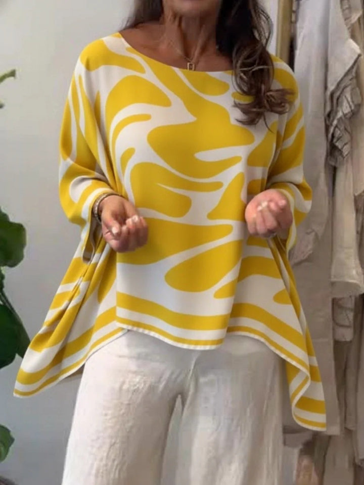 Damen Oversize Sommerbluse mit abstraktem Print, Fledermausärmeln und asymmetrischem Saum – Élovi