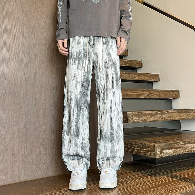 Herren Weit geschnittene Loungehose mit Marmorprint aus strukturiertem Jersey Echo Archiv