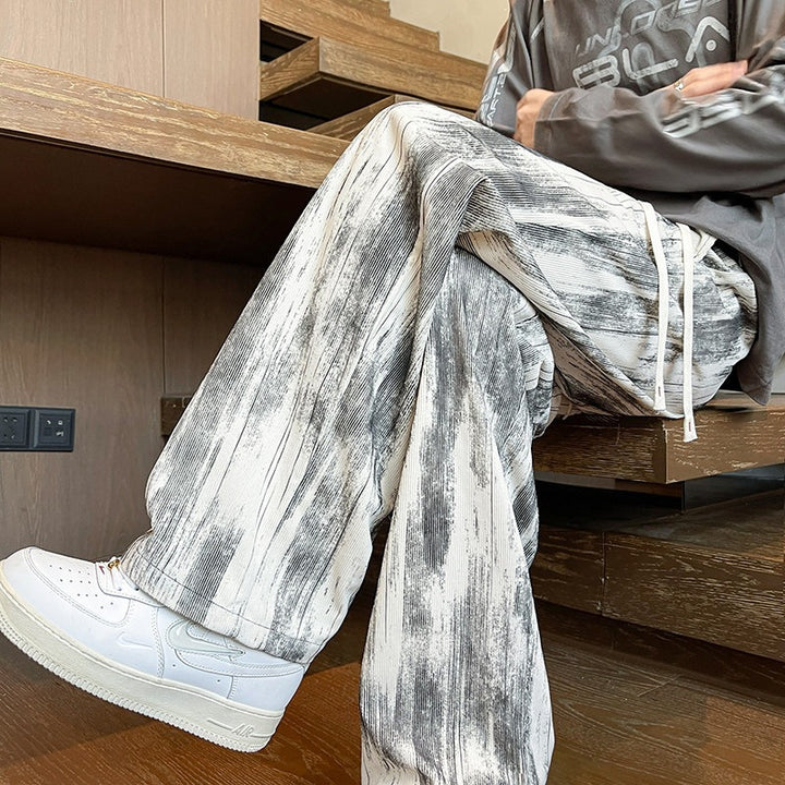 Herren Weit geschnittene Loungehose mit Marmorprint aus strukturiertem Jersey Echo Archiv