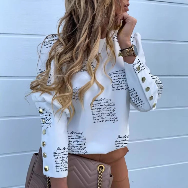 Damen Rundhalsbluse aus Viskosemix mit Ananasdruck und goldenen Dekoknopf-Manschetten – Élovi
