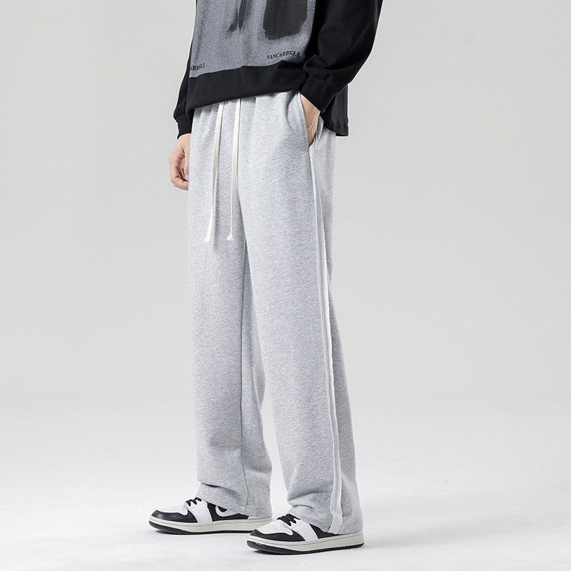 Herren weite Jogginghose im Oversize-Schnitt mit Seitenstreifen, Kordelzug & Fleecefutter Echo Archiv