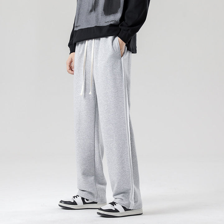 Herren weite Jogginghose im Oversize-Schnitt mit Seitenstreifen, Kordelzug & Fleecefutter Echo Archiv