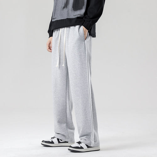 Herren weite Jogginghose im Oversize-Schnitt mit Seitenstreifen, Kordelzug & Fleecefutter Echo Archiv