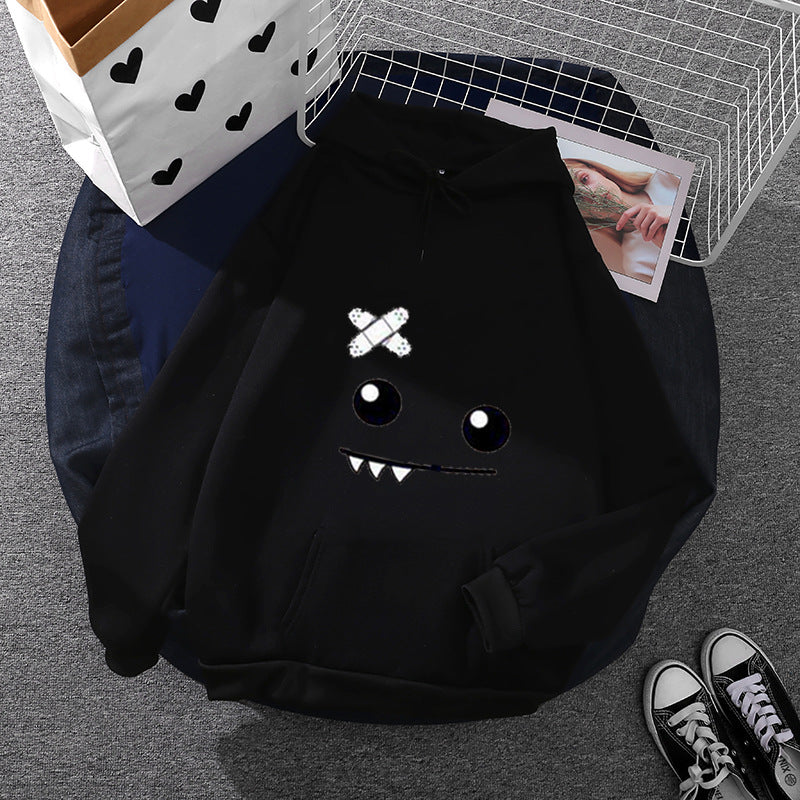 Damen Kapuzenpullover mit verspieltem Monstergesicht, Bandagen-Applikation und Kängurutasche – Auréline