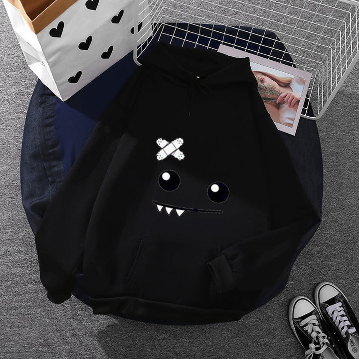 Damen Kapuzenpullover mit verspieltem Monstergesicht, Bandagen-Applikation und Kängurutasche – Auréline