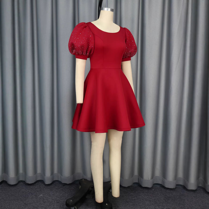 Damen Cocktailkleid mit voluminösen Puffärmeln und schimmernden Akzenten Echo Archiv
