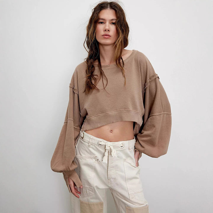 Damen cropped Oversize-Sweatshirt mit Daumenloch, fransigem Saum und weitem Raglanärmel – Avérine