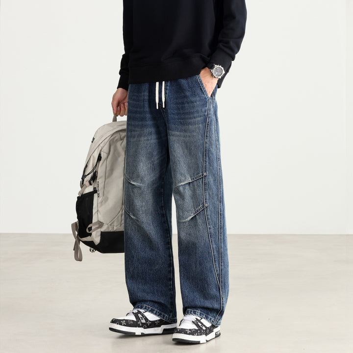Herren Weite Denim-Hose mit Tunnelzugbund, Paneelnähten und Used-Waschung Echo Archiv