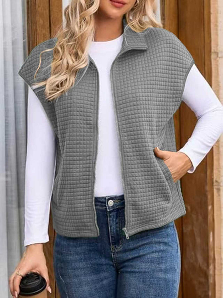 Damen Steppweste mit Reißverschluss, Stehkragen und seitlichen Taschen Echoarchiv
