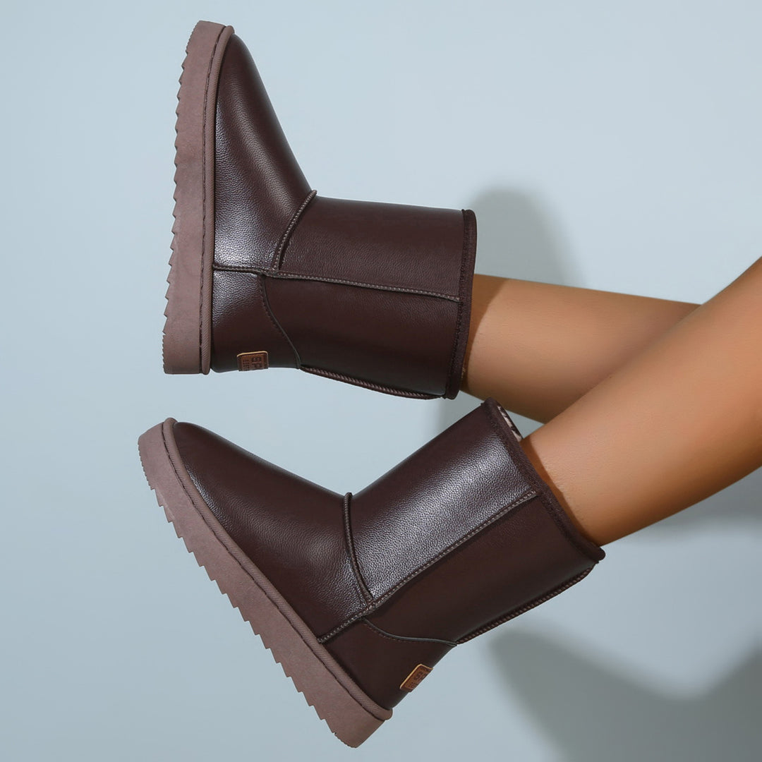 Damen Winterstiefel mit Teddyfutter, Lederoptik und flacher Plateau‑Sohle Echoarchiv