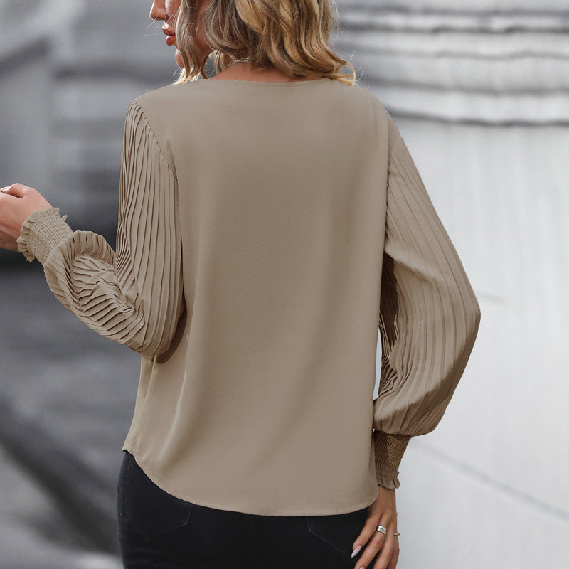 Damen Feminine V-Ausschnitt-Bluse mit plissierten Ballonärmeln und Smokmanschetten Echoarchiv