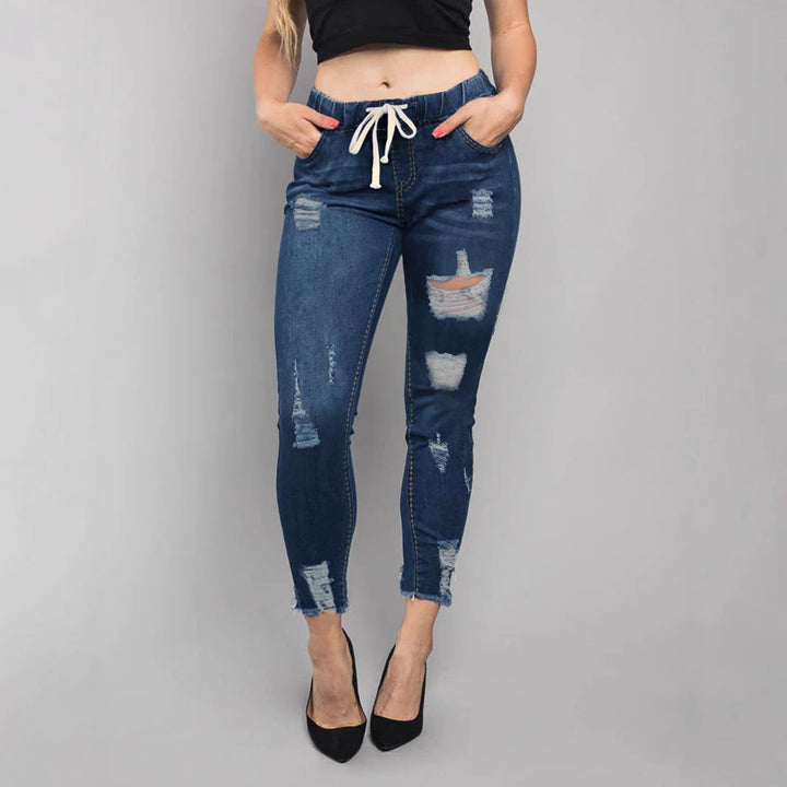 Damen Hochtaillierte Destroyed-Jogger-Jeans mit elastischem Tunnelzugbund und gekürztem Fransen-Saum Echo Archiv