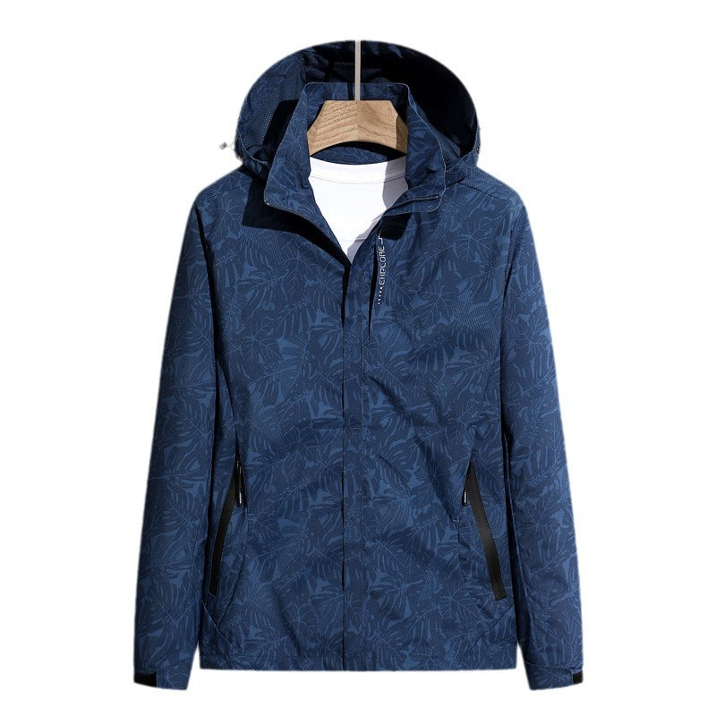 Damen leichte verpackbare Regen- und Windjacke mit Kapuze, Blattmuster und verdeckten Reißverschlüssen – Célinea