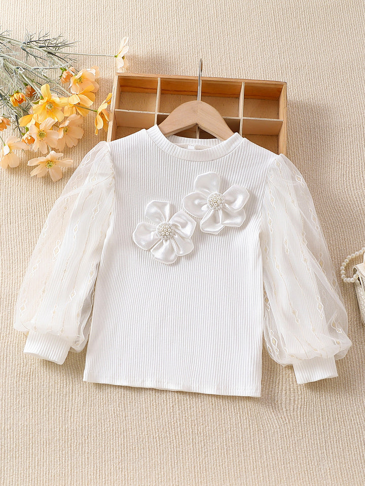 Mädchen modische Bluse mit transparenten Puffärmeln und floralen Akzenten Echo Archiv