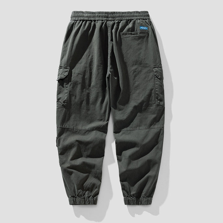 Herren Leichte Canvas-Cargohose im Joggerstil mit elastischem Bund, segmentierten Kniepaneelen und verdeckten Klappentaschen Echo Archiv