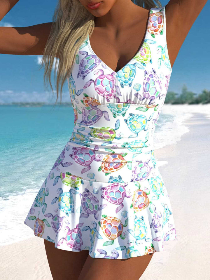 Damen Schwimmdress mit fröhlichem Schildkrötenmotiv und elegantem Rocksaum Echo Archiv