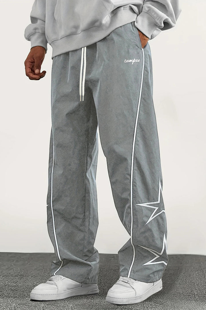 Herren Weite Trackpants mit Kontrastpaspel, Kordelzug und Sternapplikation Echo Archiv