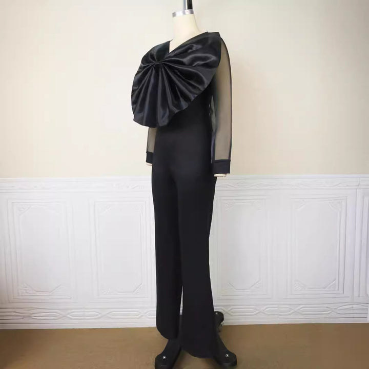 Damen eleganter Jumpsuit mit voluminösem Satinkragen und transparenten Ärmeln Echo Archiv