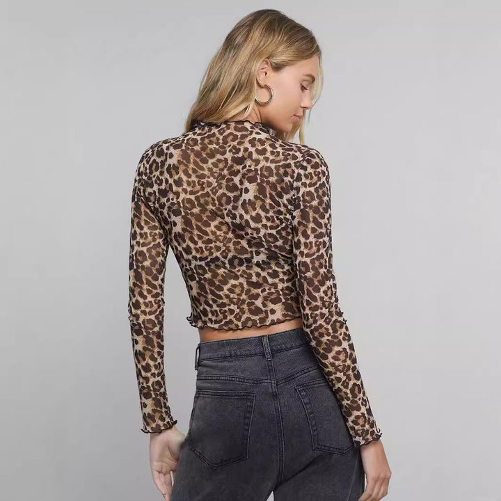 Damen nan figurbetontes bauchfreies Langarmshirt im Animalprint aus feinem Stretchnetz mit Stehkragen und Wellensaum Echo Archiv