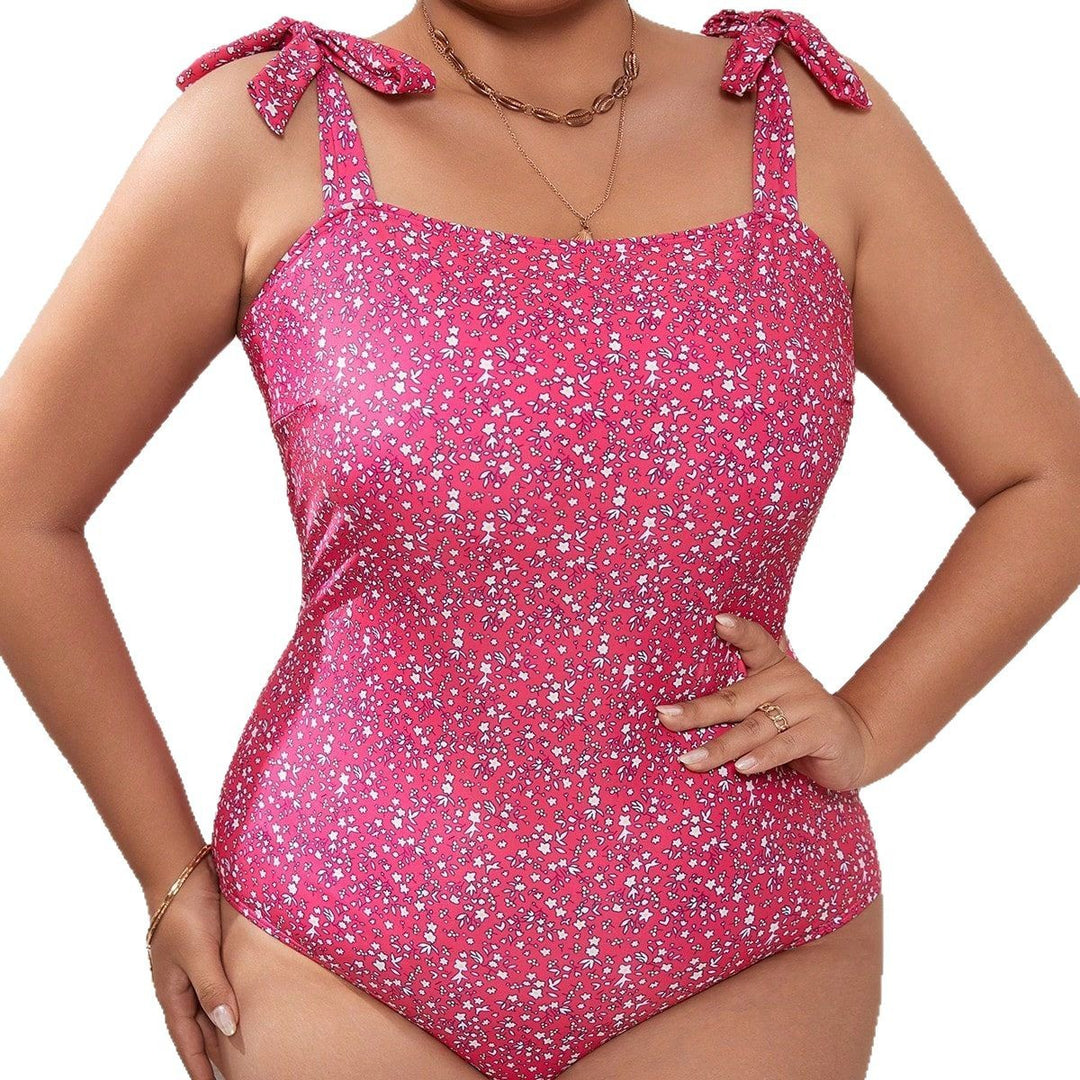 Damen Einteiliger Badeanzug mit verspieltem Blumenmuster und praktischen Trägern Echo Archiv