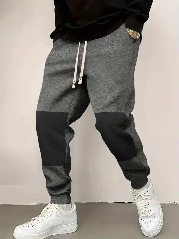 Herren elegante Sporthose mit modernen Farbblockelementen Echoarchiv