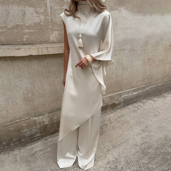 Damen Elegantes asymmetrisches Kleid mit hohem Kragen und seitlichem Schwung Echo Archiv