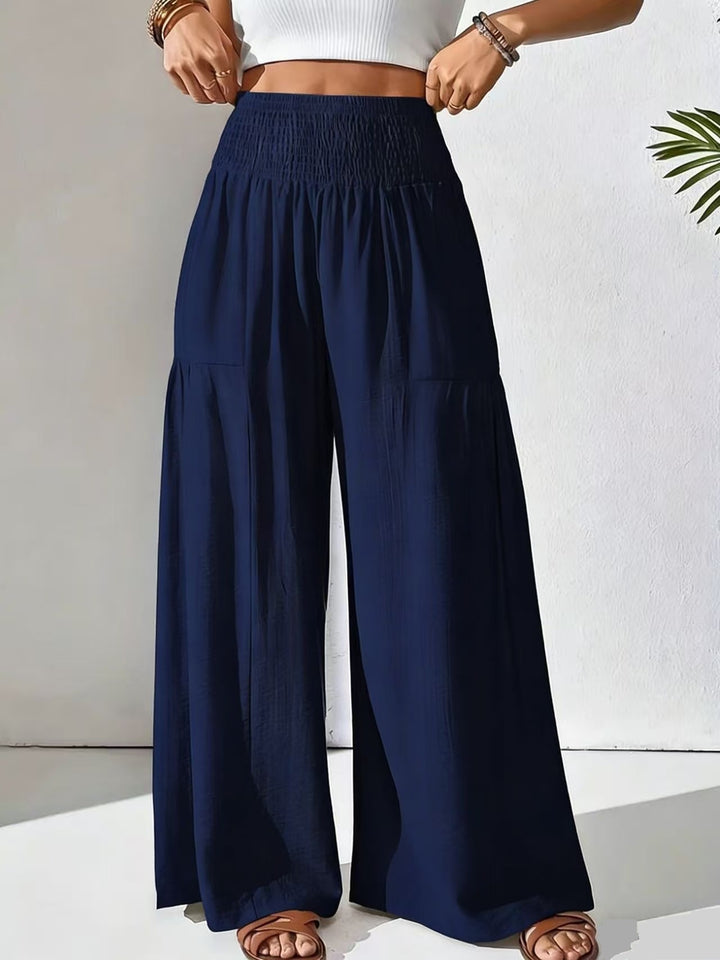 Damen weite Palazzo-Hose mit gerafftem Smock-Bund und Stufendetails – Avélisse