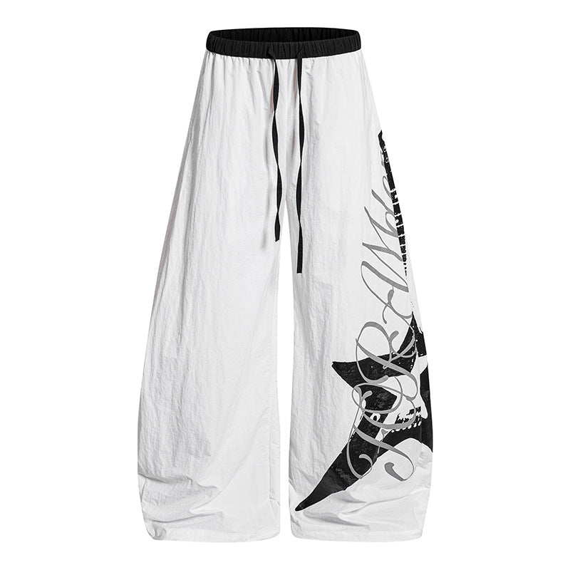 Damen Weite Palazzo-Hose mit Tunnelzugbund und großflächigem Statement-Print Echoarchiv
