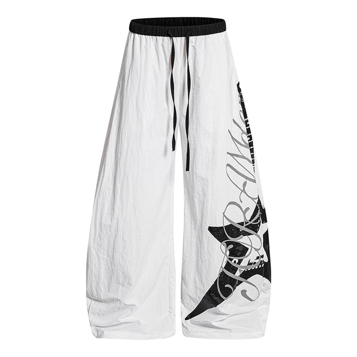 Damen Weite Palazzo-Hose mit Tunnelzugbund und großflächigem Statement-Print Echoarchiv