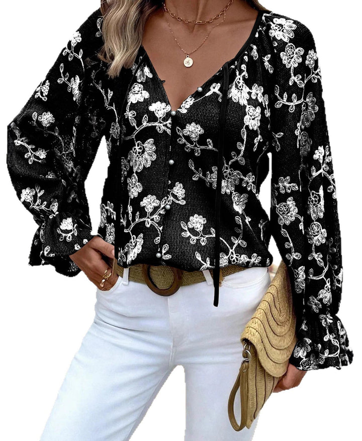 Damen V‑Neck Bluse mit floraler Stickerei, Perlenknopfleiste und Ballonärmeln – Avérine