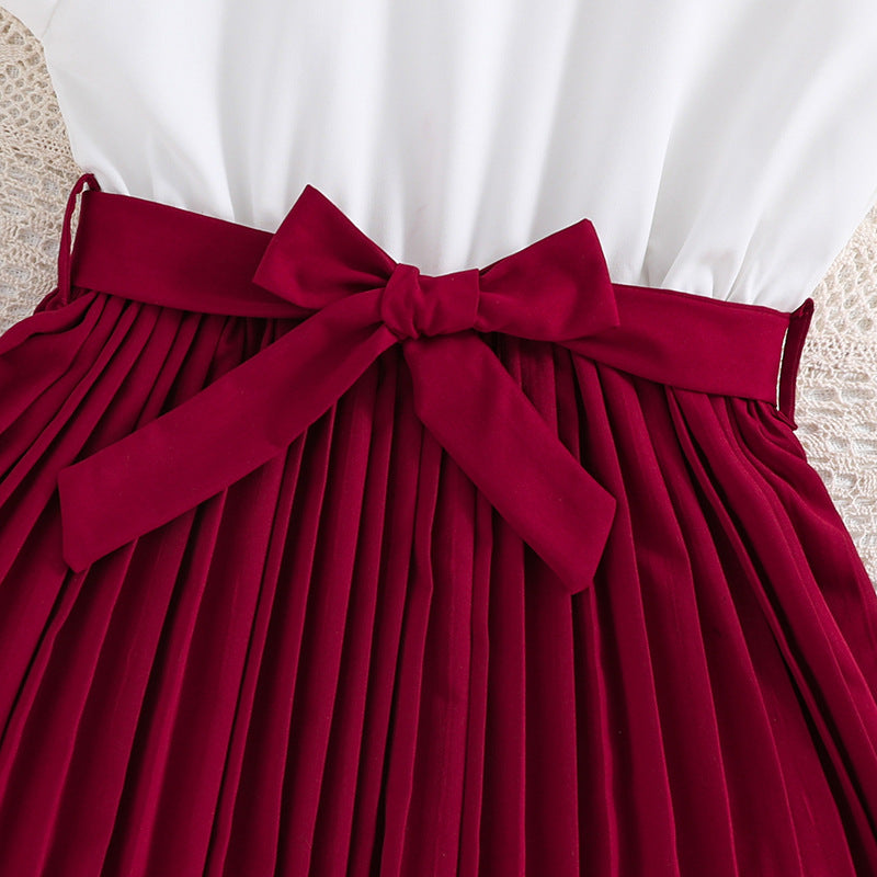 Mädchen Faltenrockkleid mit Puffärmeln und Taillenknoten Echoarchiv