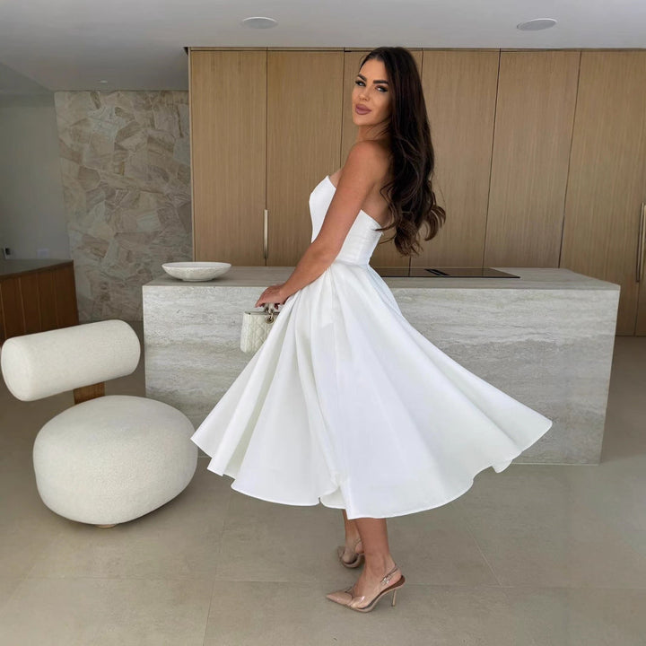 Damen A-linien Cocktailkleid mit trägerlosem Schnitt und schwingendem Rock Echoarchiv