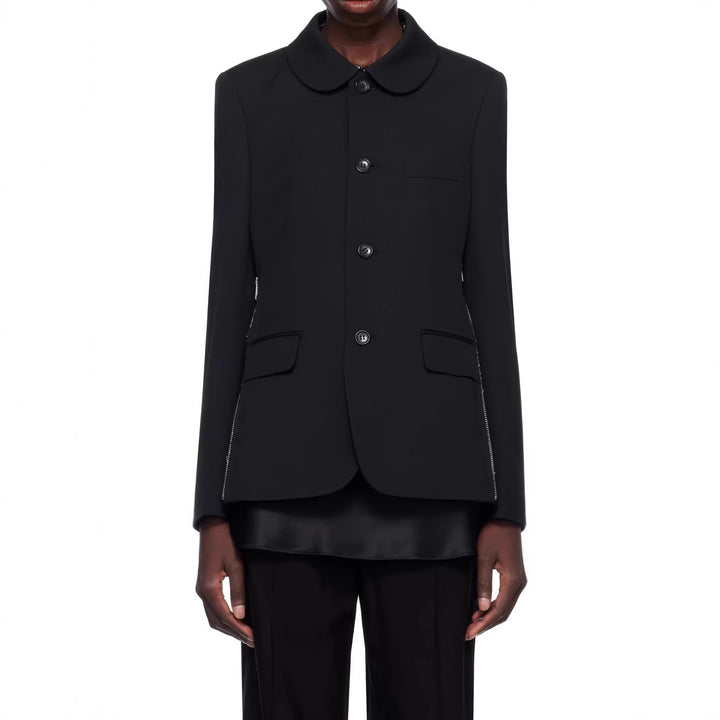 Damen Blazerjacke mit rundem Bubikragen, seitlichen Metallreißverschlüssen und Pattentaschen Echoarchiv